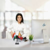 girl sitting at office desk with an indian & bhutan table flag with a black plastic stand