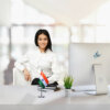 girl sitting at office desk with an indian table flag with a stainless steel stand